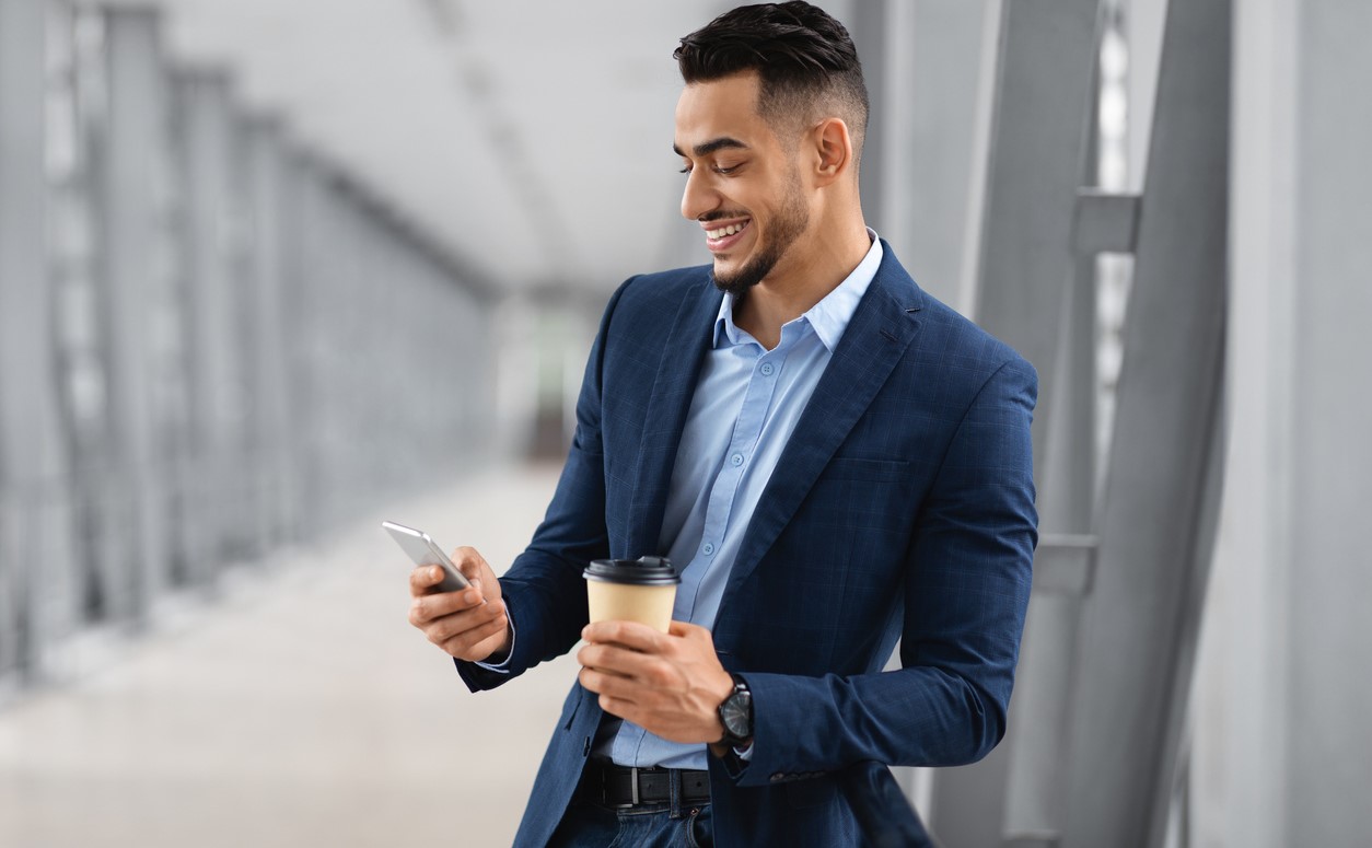 Smiling businessman on mobile phone