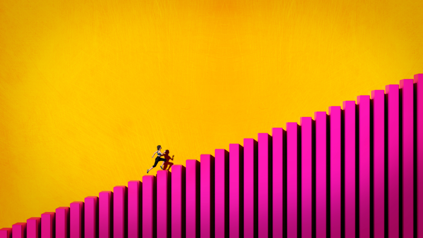 Woman Running up a colorful Graph