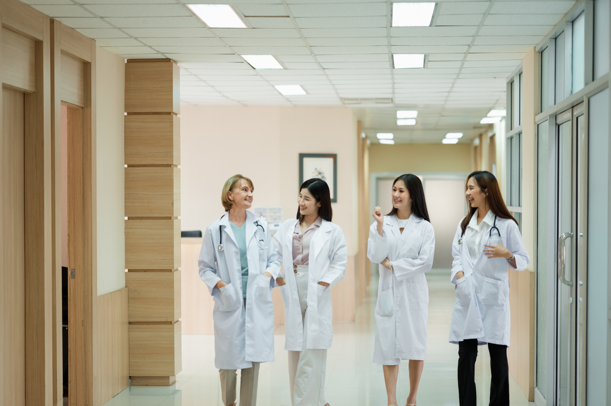 Female Doctors walking together at work