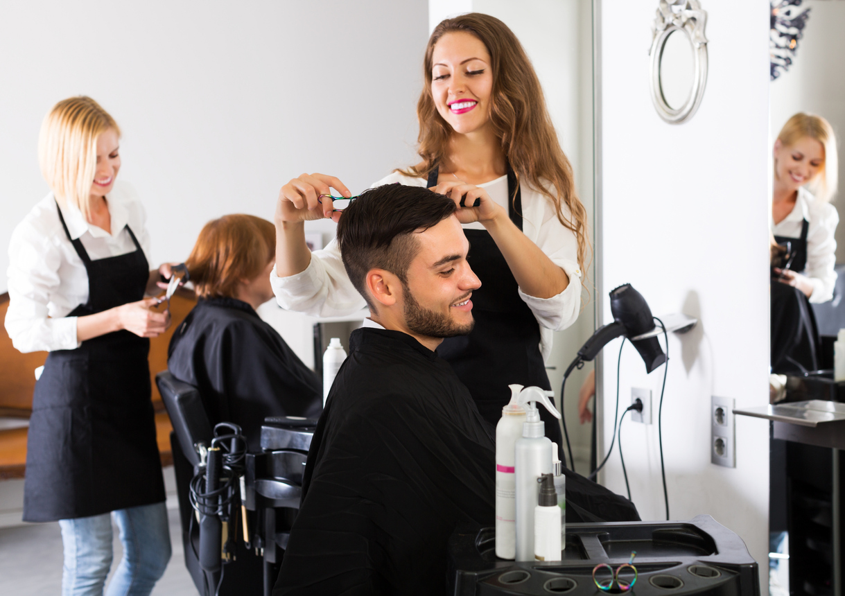 Hairdresser cutting a customer's hair