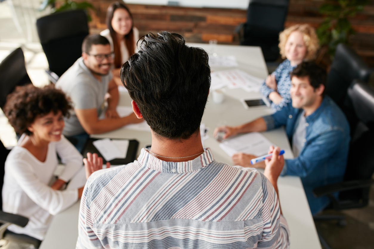 Man explaining business ideas to colleagues