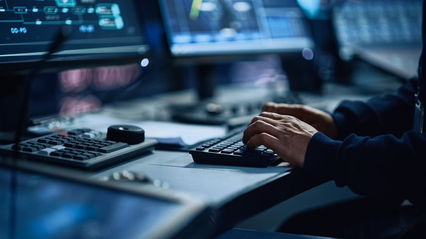 Close up of man typing on keyboard