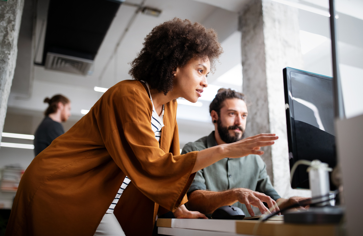 Colleagues working on a computer