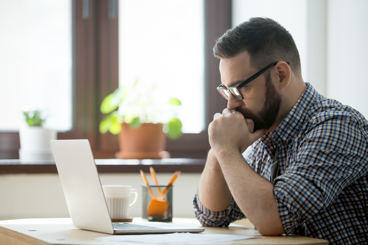 Focused man working on his laptop