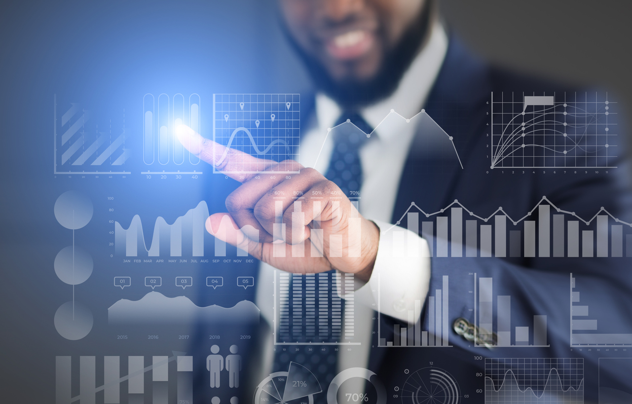 businessman pointing to virtual graph symbolizing business growth concept